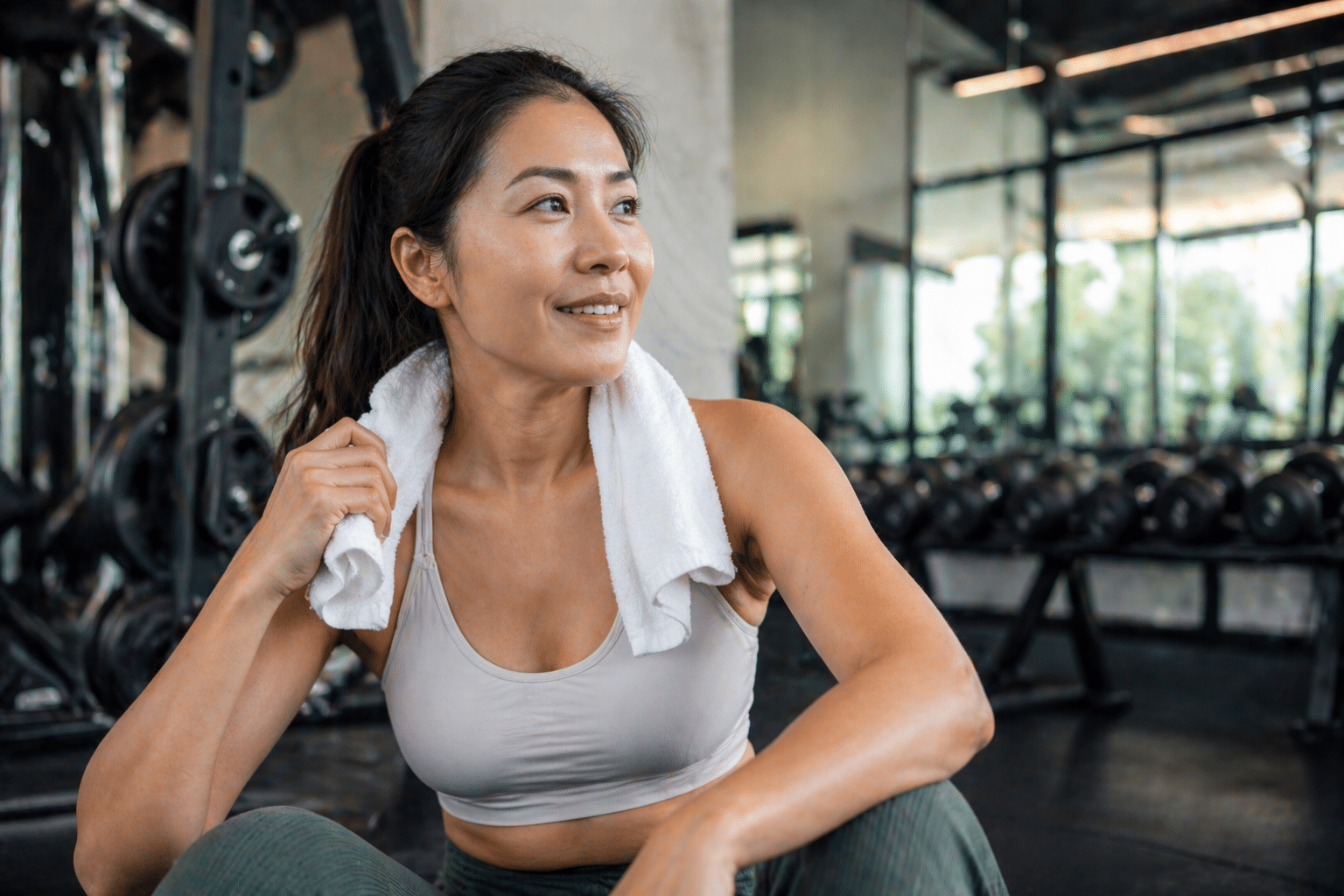 Woman at the gym considering breast implant removal surgery